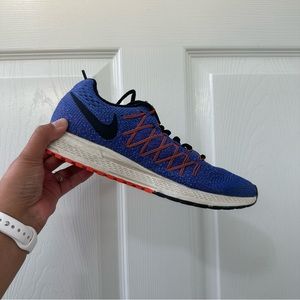 Women’s purple and orange Nike shoes